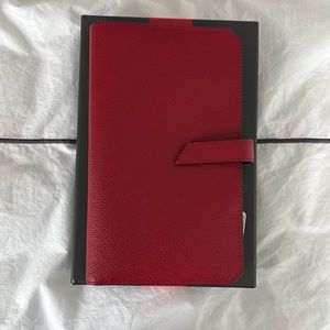 Red leather Tumi travel organizer. Great for organized travel docs
